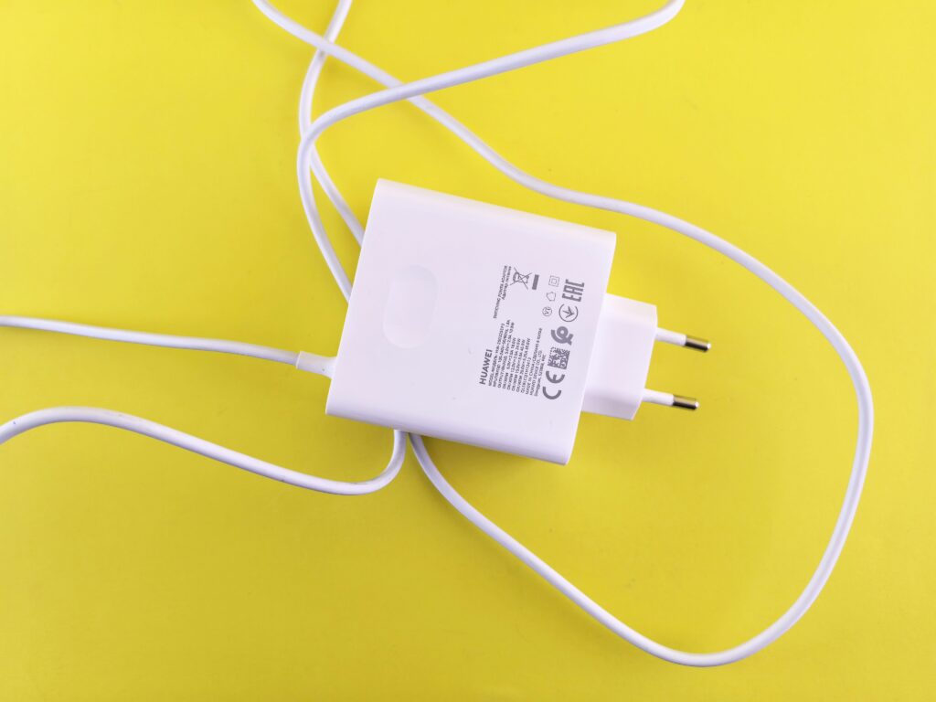 Charging wire in a yellow background.