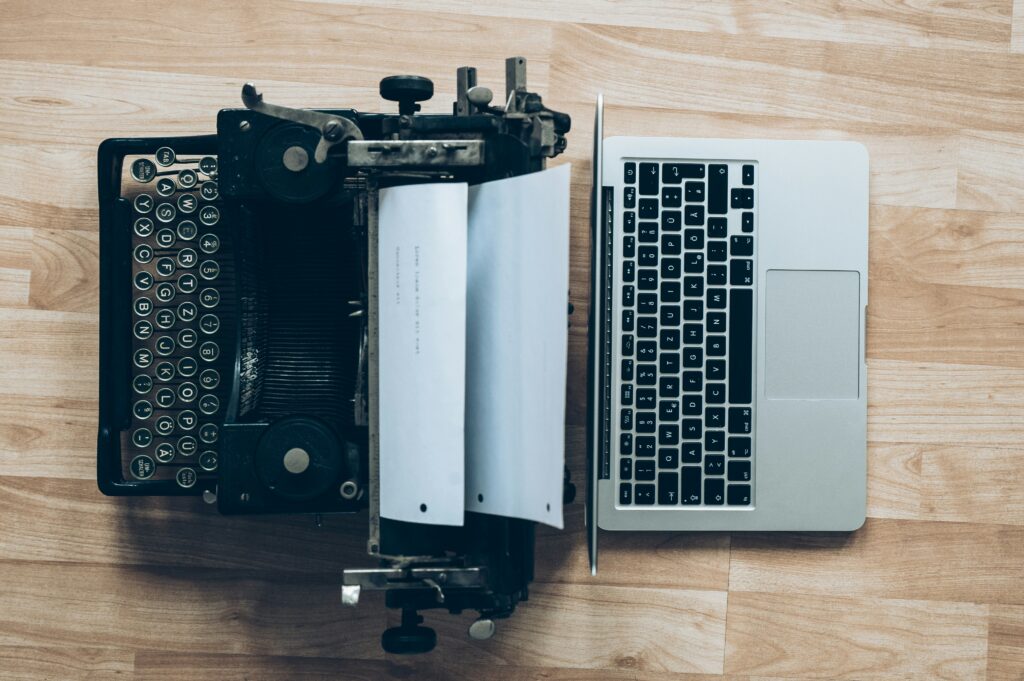Typewriter and laptop.